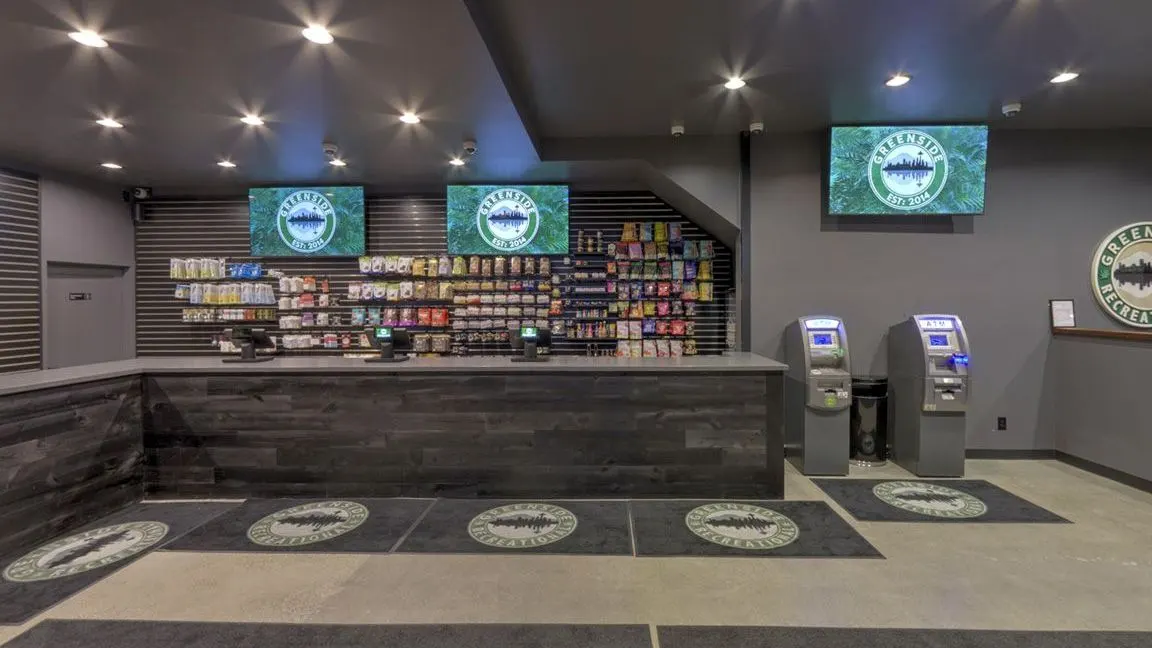 Interior view of Greenside Queen Anne with branded floor mats and kiosks